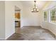 Open concept dining room with wood floors flows seamlessly into an adjacent kitchen space at 111 Macfarren Ln, Summerville, SC 29485