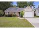Charming single-story home featuring a brick facade, blue shutters, and a well-maintained front yard at 111 Macfarren Ln, Summerville, SC 29485