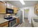 Functional kitchen featuring stainless steel appliances, tile backsplash, and wood-look flooring at 111 Macfarren Ln, Summerville, SC 29485