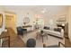 Stylishly furnished living area with a fireplace, ceiling fan, and adjacent dining space, perfect for relaxation at 111 Macfarren Ln, Summerville, SC 29485