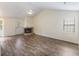 Spacious living room featuring a brick fireplace, vaulted ceilings, and a glass door leading to outdoor space at 111 Macfarren Ln, Summerville, SC 29485