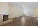 Inviting living room with a brick fireplace, hardwood floors, and ample natural light for a comfortable atmosphere at 111 Macfarren Ln, Summerville, SC 29485