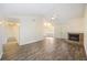 Bright and airy living room with vaulted ceilings, a cozy fireplace, and easy access to the dining area at 111 Macfarren Ln, Summerville, SC 29485