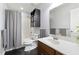 Functional bathroom with a shower-tub combo, single sink vanity, and dark wooden floors at 1110 Flyway Rd, Summerville, SC 29483
