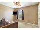 Comfortable bedroom with neutral paint, ceiling fan, a window, and a television at 1110 Flyway Rd, Summerville, SC 29483