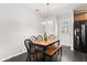 Well-lit kitchen dining area with modern wooden table and seating at 1110 Flyway Rd, Summerville, SC 29483