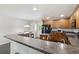 Open kitchen layout with a breakfast bar and wood cabinets at 1110 Flyway Rd, Summerville, SC 29483