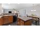 Bright eat-in kitchen with a center island, dining table, and modern appliances at 1110 Flyway Rd, Summerville, SC 29483
