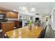 View of the kitchen with brown cabinets, black appliances, and an open layout with an eat-in kitchen table at 1110 Flyway Rd, Summerville, SC 29483