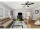 Inviting living room with a comfortable sofa, accent chairs, a patterned rug, and a ceiling fan at 1110 Flyway Rd, Summerville, SC 29483