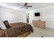 Spacious main bedroom with neutral walls, a ceiling fan, a TV, and a view into the main bathroom at 1110 Flyway Rd, Summerville, SC 29483
