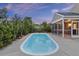 Backyard pool with serene surroundings and an adjacent screened-in porch perfect for relaxation at 1110 Flyway Rd, Summerville, SC 29483