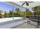 Screened-in porch with seating overlooking a private pool and backyard at 1110 Flyway Rd, Summerville, SC 29483