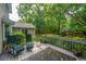 Back deck with seating provides relaxing backyard wooded view at 113 Essex Dr, Summerville, SC 29485