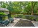 Inviting back deck with outdoor seating and view of private, lush backyard at 113 Essex Dr, Summerville, SC 29485