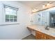 Bathroom with a large mirror, sink and vanity with window lighting at 113 Essex Dr, Summerville, SC 29485