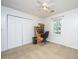 Bright bedroom with plush carpet, ceiling fan, closet and wooden desk near a window at 113 Essex Dr, Summerville, SC 29485