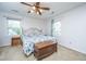 Bright bedroom with two windows, a ceiling fan, carpet, and vintage trunk at 113 Essex Dr, Summerville, SC 29485