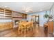 Dining room features a brick fireplace, hardwood floors, built-in shelves and a wooden dining table at 113 Essex Dr, Summerville, SC 29485