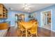 Dining room with blue walls, hardwood flooring, and views to the kitchen and living area at 113 Essex Dr, Summerville, SC 29485