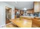 Charming kitchen with wooden cabinets, stainless steel appliances, and eat-in dining area at 113 Essex Dr, Summerville, SC 29485