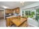 Bright kitchen area featuring an eat-in dining space, wood cabinets, and a large window with backyard views at 113 Essex Dr, Summerville, SC 29485