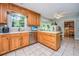 Functional kitchen featuring oak cabinetry, neutral countertops, and bright natural light at 113 Essex Dr, Summerville, SC 29485