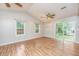 Spacious living room featuring wood laminate flooring and sliding glass door access to the backyard at 113 Essex Dr, Summerville, SC 29485