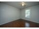 Bedroom featuring hardwood floors, neutral walls, a ceiling fan, and a window letting in natural light at 115 Sully St, Goose Creek, SC 29445