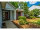 Close up of the home's entry featuring a covered porch and decorative shutters at 115 Sully St, Goose Creek, SC 29445
