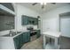 Updated kitchen features stainless steel appliances, ample counter space, and stylish green cabinetry at 115 Sully St, Goose Creek, SC 29445