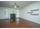 Spacious living room with hardwood floors, fireplace, and natural light from arched windows at 115 Sully St, Goose Creek, SC 29445