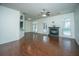 Living area featuring hardwood floors, a fireplace, and open access to the dining and kitchen at 115 Sully St, Goose Creek, SC 29445