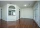 Bright living space with hardwood floors, pass-through to kitchen, and neutral walls at 115 Sully St, Goose Creek, SC 29445