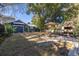 Spacious backyard with shed, patio, dining area, and grill, perfect for outdoor entertaining and relaxation at 1153 King St, Charleston, SC 29403