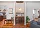 Stylish bar area with custom cabinetry, beverage refrigerator, and elegant decor, perfect for entertaining guests at 1153 King St, Charleston, SC 29403