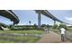 Picturesque boardwalk winding through a natural habitat, enhanced by overpasses and native birds at 1153 King St, Charleston, SC 29403