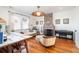 Inviting living room boasts a brick fireplace, comfortable seating, and stylish decor creating a relaxing ambiance at 1153 King St, Charleston, SC 29403