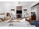 Cozy living room featuring comfortable seating, a brick fireplace, and stylish decor for a relaxed atmosphere at 1153 King St, Charleston, SC 29403