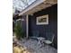 Stylish black shed exterior with seating area, offering a versatile and inviting outdoor space at 1153 King St, Charleston, SC 29403
