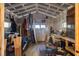 Bright shed interior with surfboard storage and workspace; a perfect spot for hobbies and projects at 1153 King St, Charleston, SC 29403
