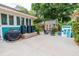 Spacious backyard patio with grilling area, storage shed, and play area at 1158 Shoreside Way, Mount Pleasant, SC 29464