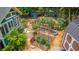 Backyard garden featuring a green shed, a tool shed and planted, mulched garden beds at 1158 Shoreside Way, Mount Pleasant, SC 29464