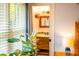 Bright, inviting bathroom features a wood vanity, square mirror, and stylish lighting at 1158 Shoreside Way, Mount Pleasant, SC 29464