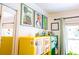 Bedroom view showcasing colorful cabinets, decorative art, and a bright window at 1158 Shoreside Way, Mount Pleasant, SC 29464