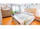 Light-filled bedroom features hardwood floors, stylish decor and wooden furniture at 1158 Shoreside Way, Mount Pleasant, SC 29464