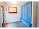Light and airy entryway featuring blue storage cabinet and light wood floor at 1158 Shoreside Way, Mount Pleasant, SC 29464