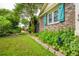Charming home exterior with lush front yard and colorful window shutters at 1158 Shoreside Way, Mount Pleasant, SC 29464