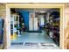 Well-organized garage with ample storage, shelving, and work space, perfect for projects and parking at 1158 Shoreside Way, Mount Pleasant, SC 29464