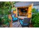 Cozy shed with a TV, seating, and organized storage, perfect as a backyard getaway or hobby space at 1158 Shoreside Way, Mount Pleasant, SC 29464